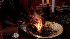 Spiritual healing ceremony with warm candlelight and ceremonial tools